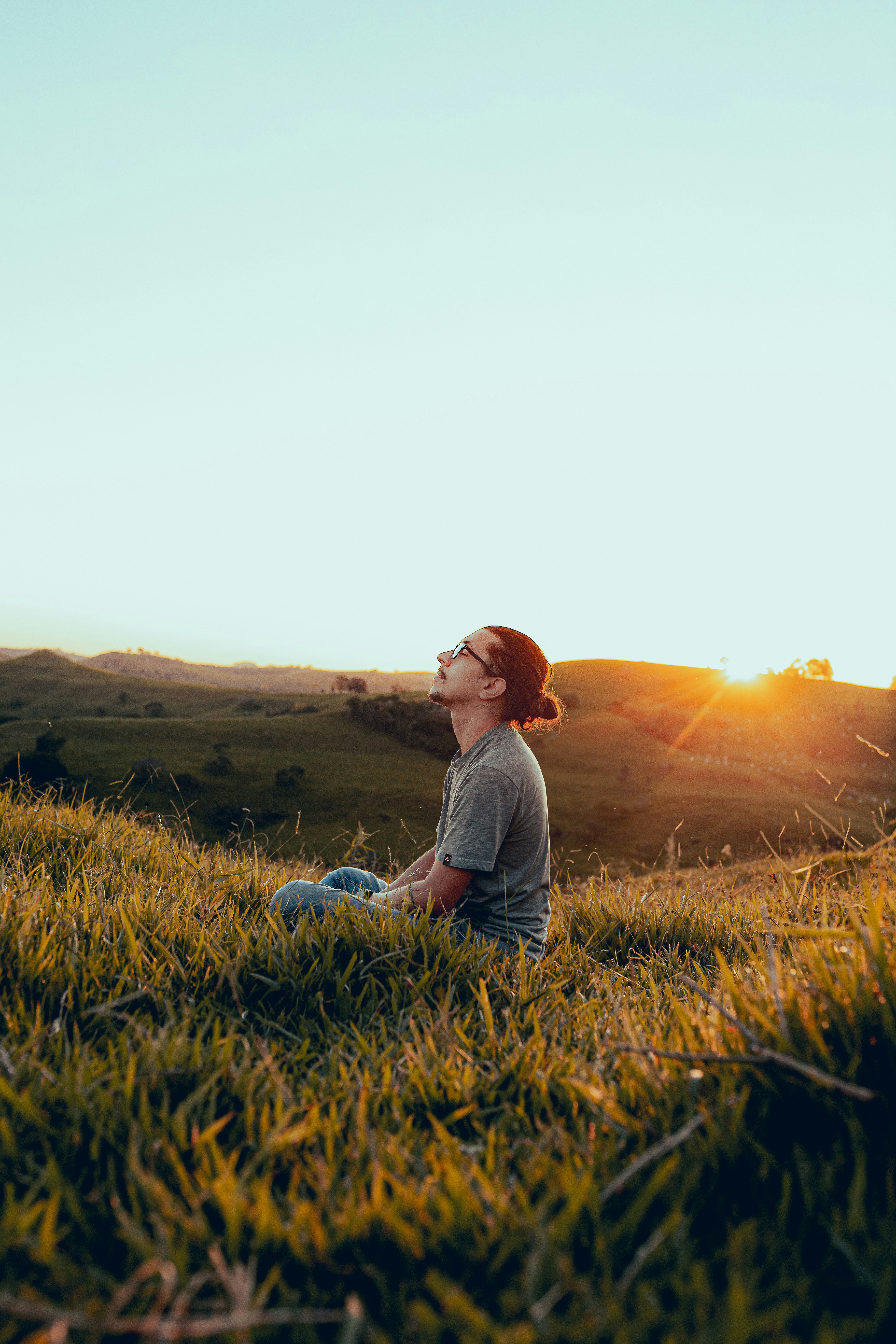 Man sitting in a field, Confident Money Life
